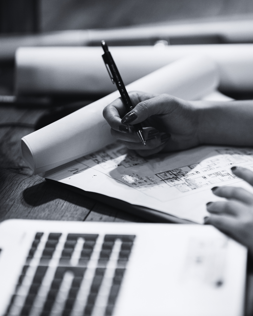 Woman typing on a paper at her workspace